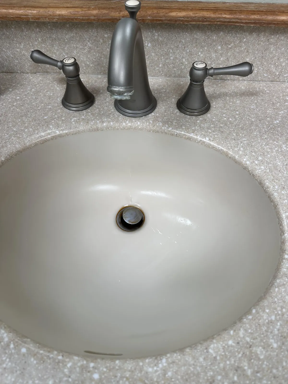 Bathroom sink and fixtures after, spotless and polished